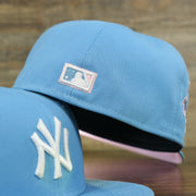 MLB cooperstown logo on the New York Yankees 1996 World Series Patch Pink Bottom 59Fifty Fitted Cap | Light Blue