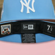 MLB and new era label on the New York Yankees 1996 World Series Patch Pink Bottom 59Fifty Fitted Cap | Light Blue