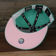 underside of the Anaheim Angels 40th Anniversary Side Patch Pink Bottom 59Fifty Fitted Cap | Mint