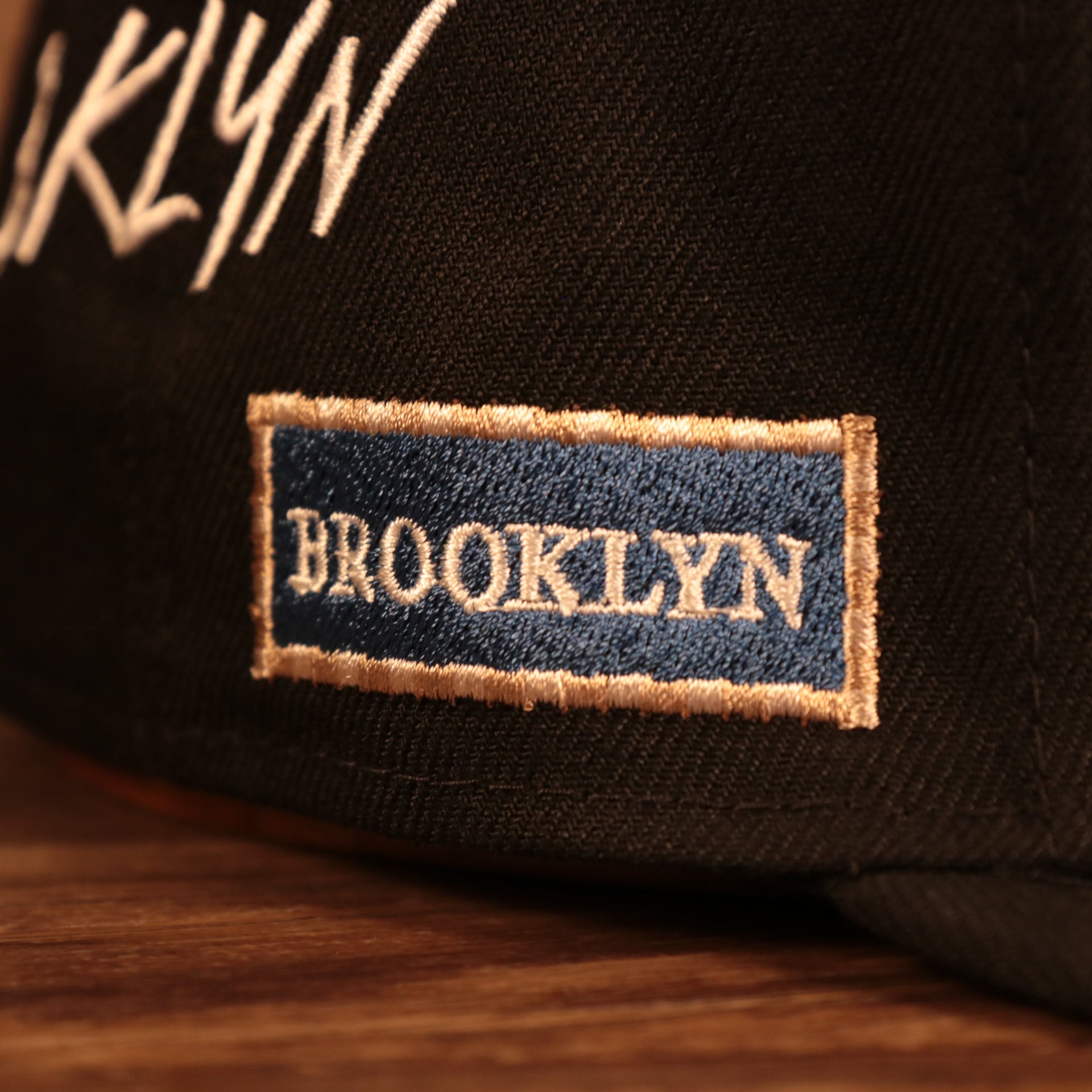 Brooklyn vintage side patch street sign close up on the Brooklyn Nets City Transit All Over Side Patch Gray Bottom 59Fifty Fitted Cap