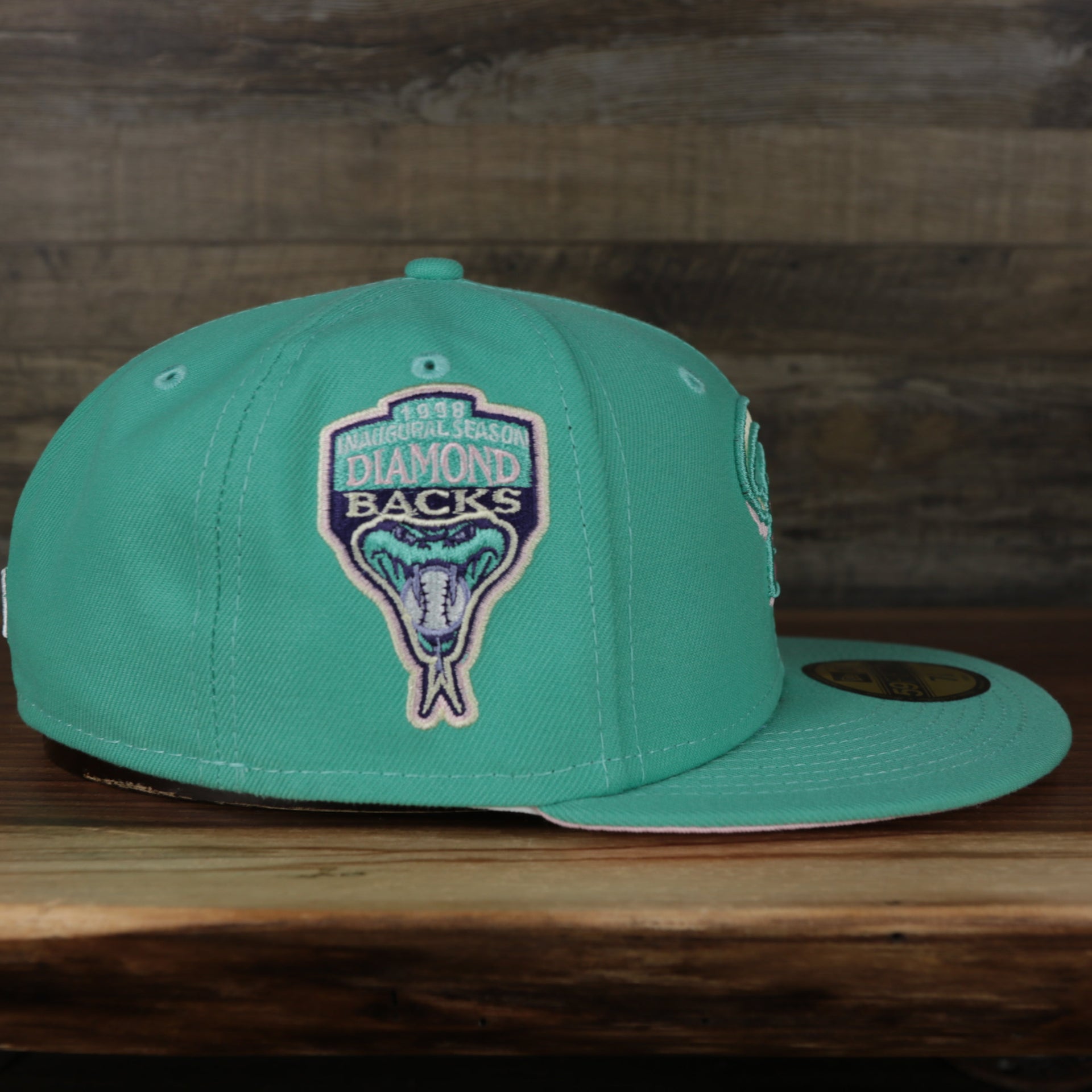 wearers right side of the Arizona Diamondbacks 1993 Inaugural Season Side Patch Pink Bottom 59Fifty Fitted Cap | Mint