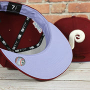 purple under visor on the Cooperstown Philadelphia Phillies Pop Sweat Pastel World Series Side Patch Fitted Cap With Purple Undervisor | Maroon 59Fifty Cap