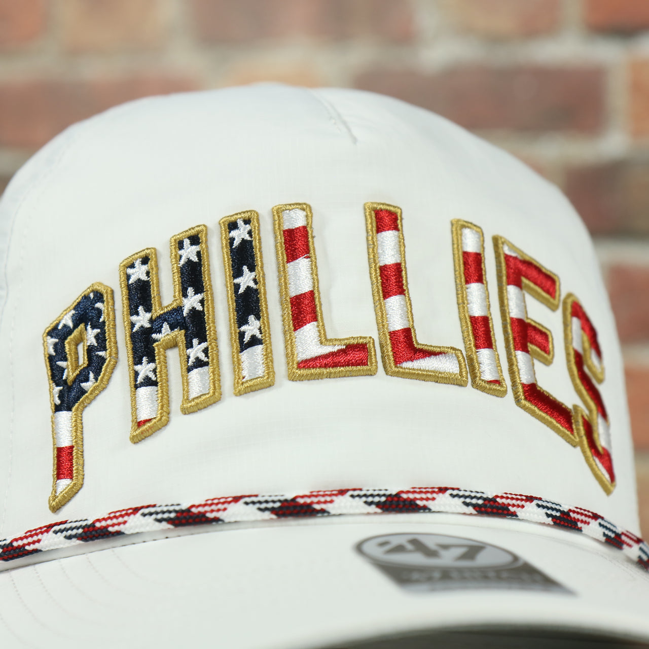 phillies logo on the Philadelphia Phillies Stars and Stripes Wordmark Gray Bottom Dad Hat | White Dad Hat