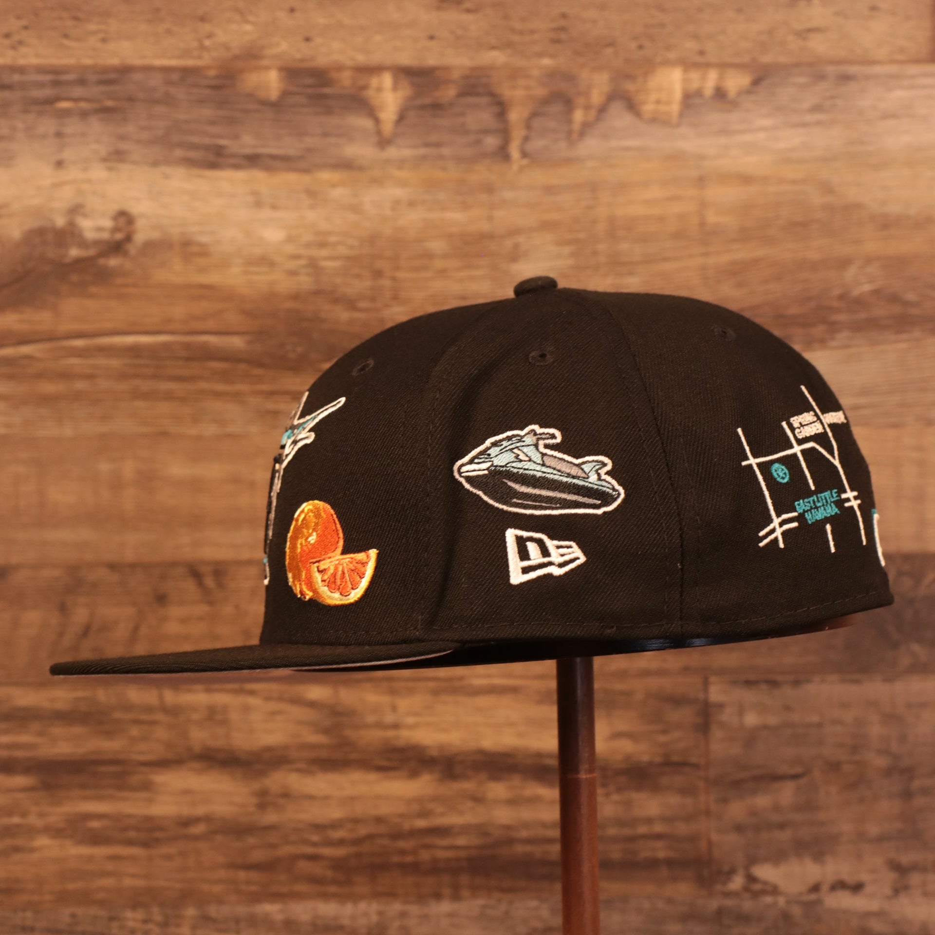 Wearer's left of the Florida Marlins Cooperstown City Transit All Over Side Patch Gray Bottom 59Fifty Fitted Cap