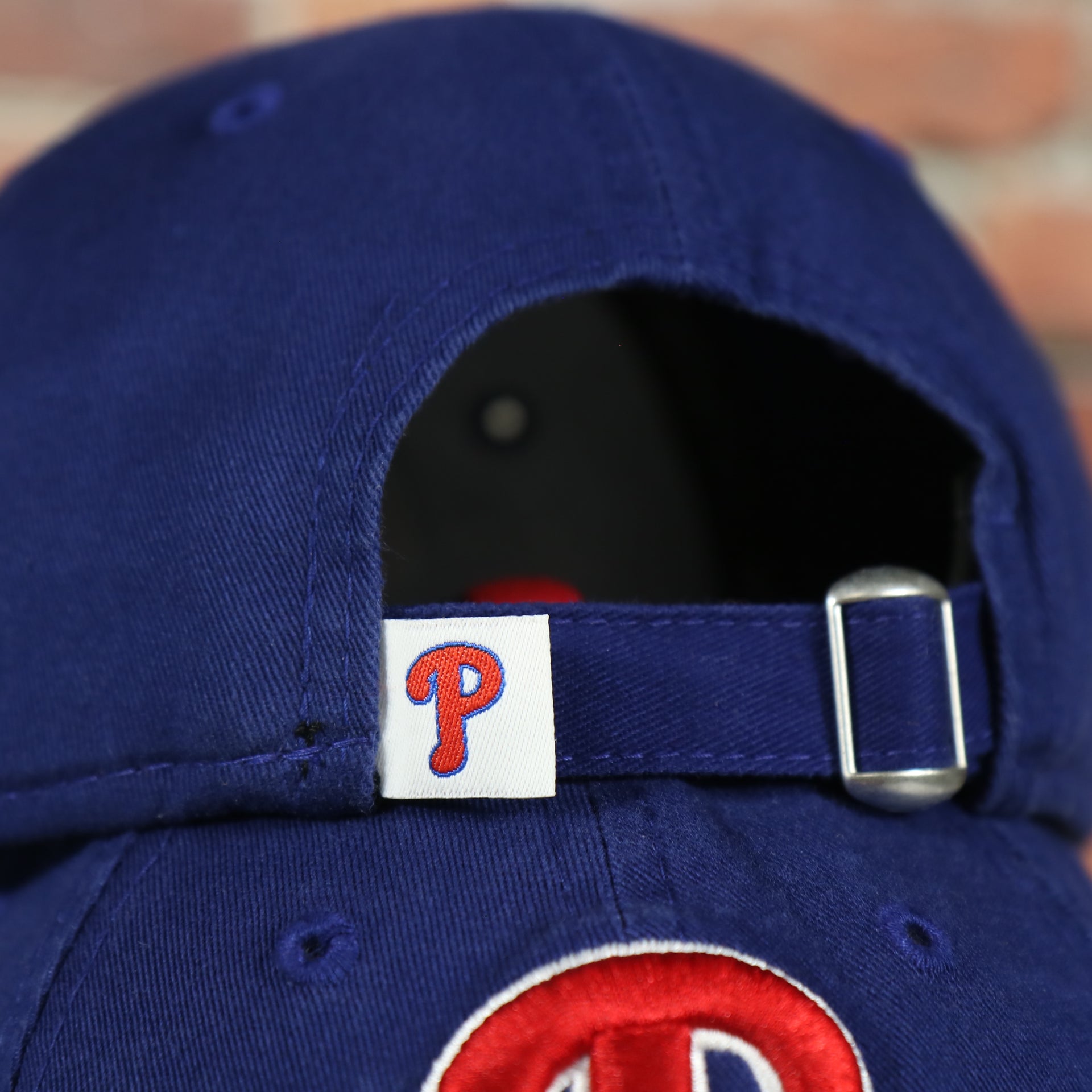 Adjustable strap on the back of the Philadelphia Phillies Core Classic Youth Royal/Red 9Twenty Kid's Dad Hat