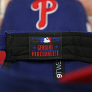 Genuine Merchandise tag on the Philadelphia Phillies Core Classic Youth Royal/Red 9Twenty Kid's Dad Hat