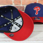 Red under visor on the Philadelphia Phillies Core Classic Youth Royal/Red 9Twenty Kid's Dad Hat