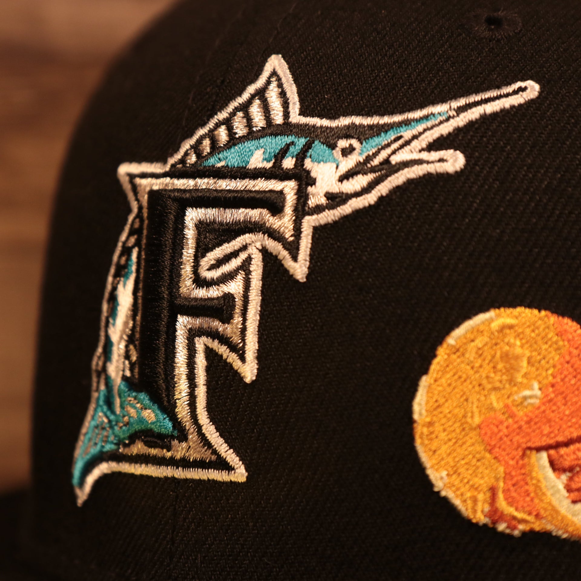 Close up of the Florida Marlins logo on the Florida Marlins Cooperstown City Transit All Over Side Patch Gray Bottom 59Fifty Fitted Cap