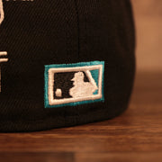 Close up of the MLB batterman logo on the back of the Florida Marlins Cooperstown City Transit All Over Side Patch Gray Bottom 59Fifty Fitted Cap