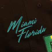 Close up of the script of Miami Florida on the Florida Marlins Cooperstown City Transit All Over Side Patch Gray Bottom 59Fifty Fitted Cap