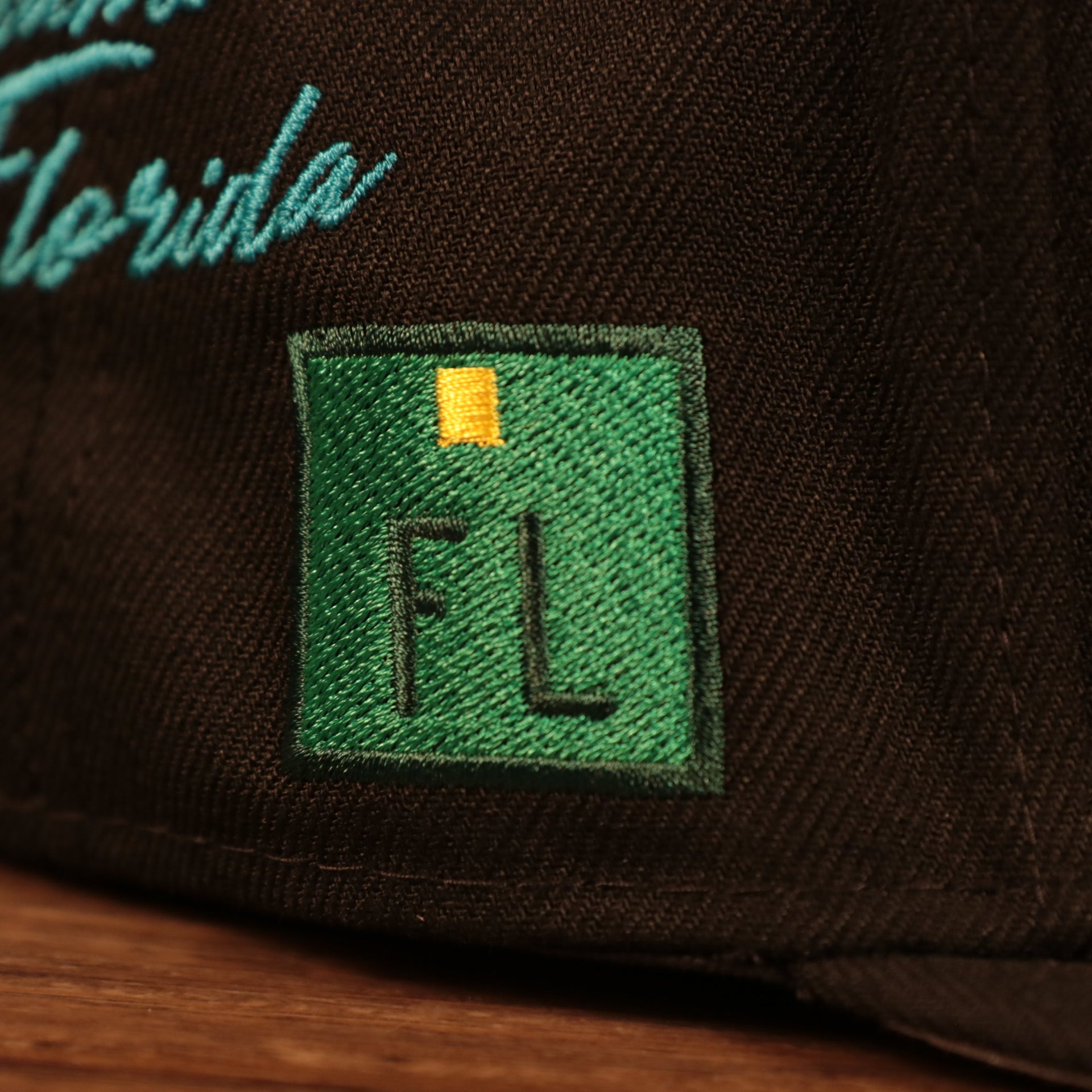Close up of the FL sign on the Florida Marlins Cooperstown City Transit All Over Side Patch Gray Bottom 59Fifty Fitted Cap