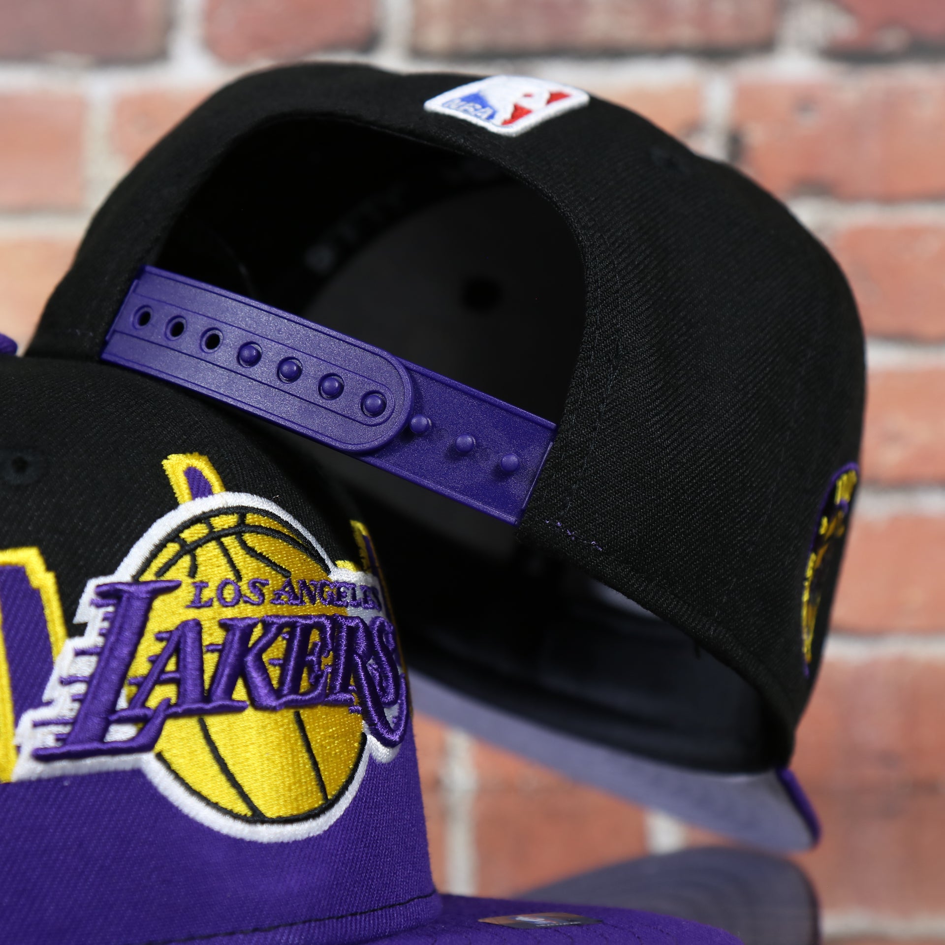 purple adjustable snap on the Los Angeles Lakers City Skyline Side Patch 9Fifty Youth Snapback Hat | Los Angeles Skyline 950
