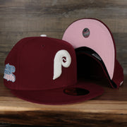 front and bottom of the Philadelphia Phillies 1980 World Series Glow In The Dark Pink Brim 59fifty Cap | Maroon