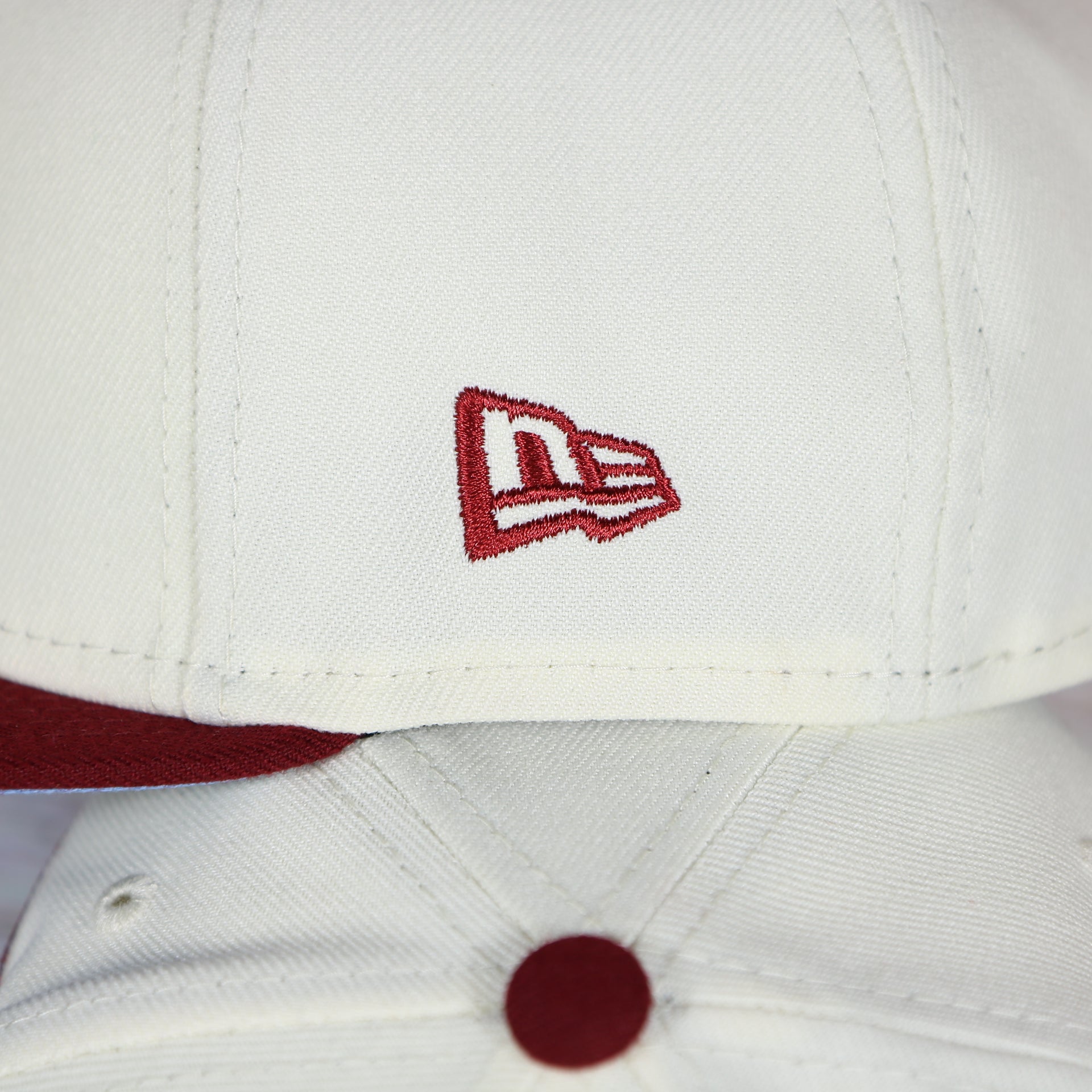 New Era logo close up on the Philadelphia Phillies Cooperstown City Hall Logo Veterans Stadium Side Patch Powder Blue UV 59Fifty Fitted Cap | Chrome/Maroon Cap Swag Exclusive