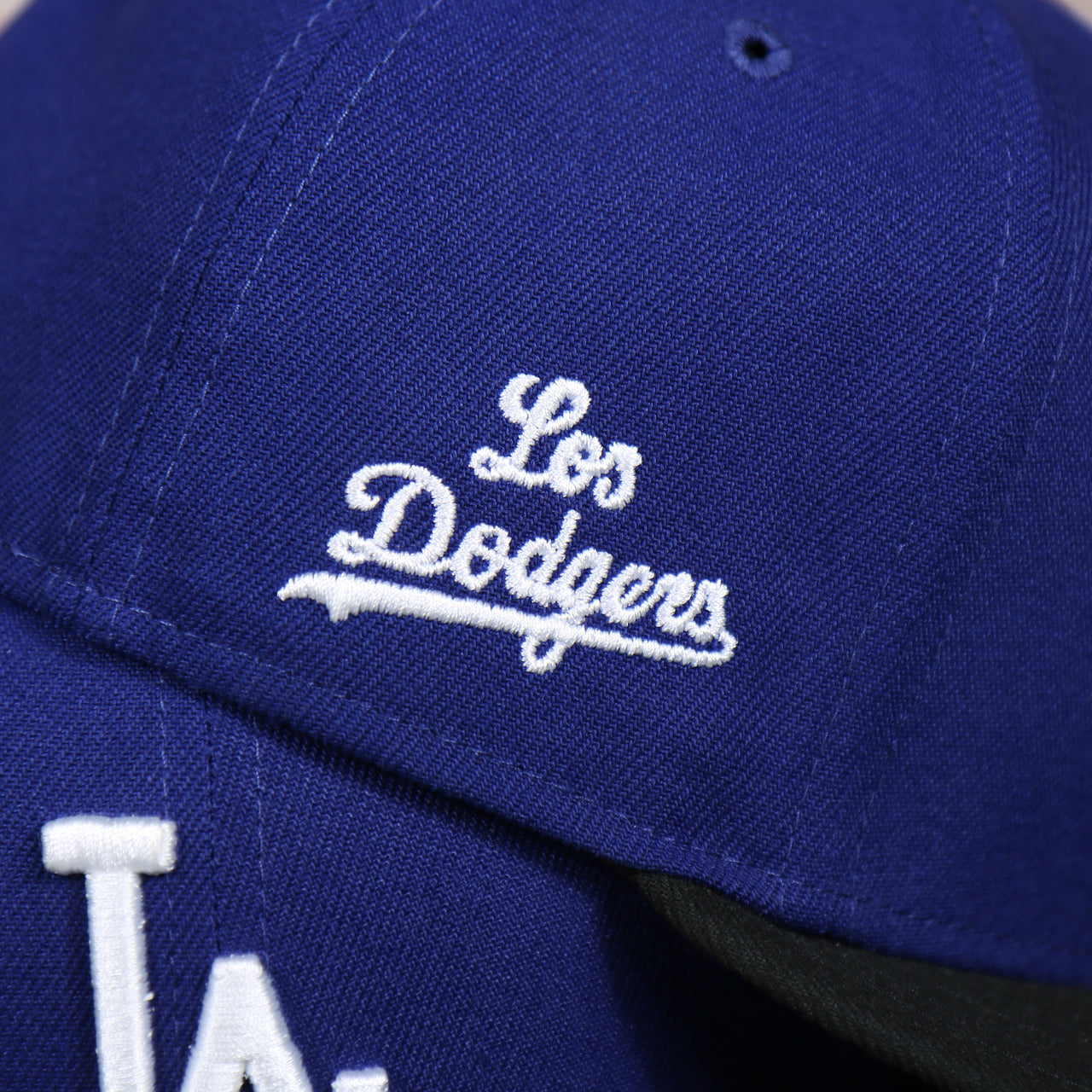 dodgers wordmark on the Los Angeles Dodgers 2022 City Connect Side Patch 59Fifty Fitted Cap | New Era Royal/Black