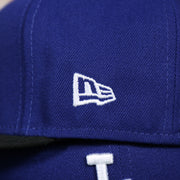 new era logo on the Los Angeles Dodgers 2022 City Connect Side Patch 59Fifty Fitted Cap | New Era Royal/Black