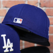 MLB batterman logo on the Los Angeles Dodgers 2022 City Connect Side Patch 59Fifty Fitted Cap | New Era Royal/Black