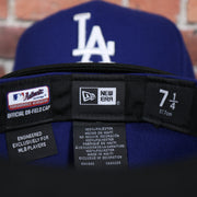 mlb and new era label on the Los Angeles Dodgers 2022 City Connect Side Patch 59Fifty Fitted Cap | New Era Royal/Black
