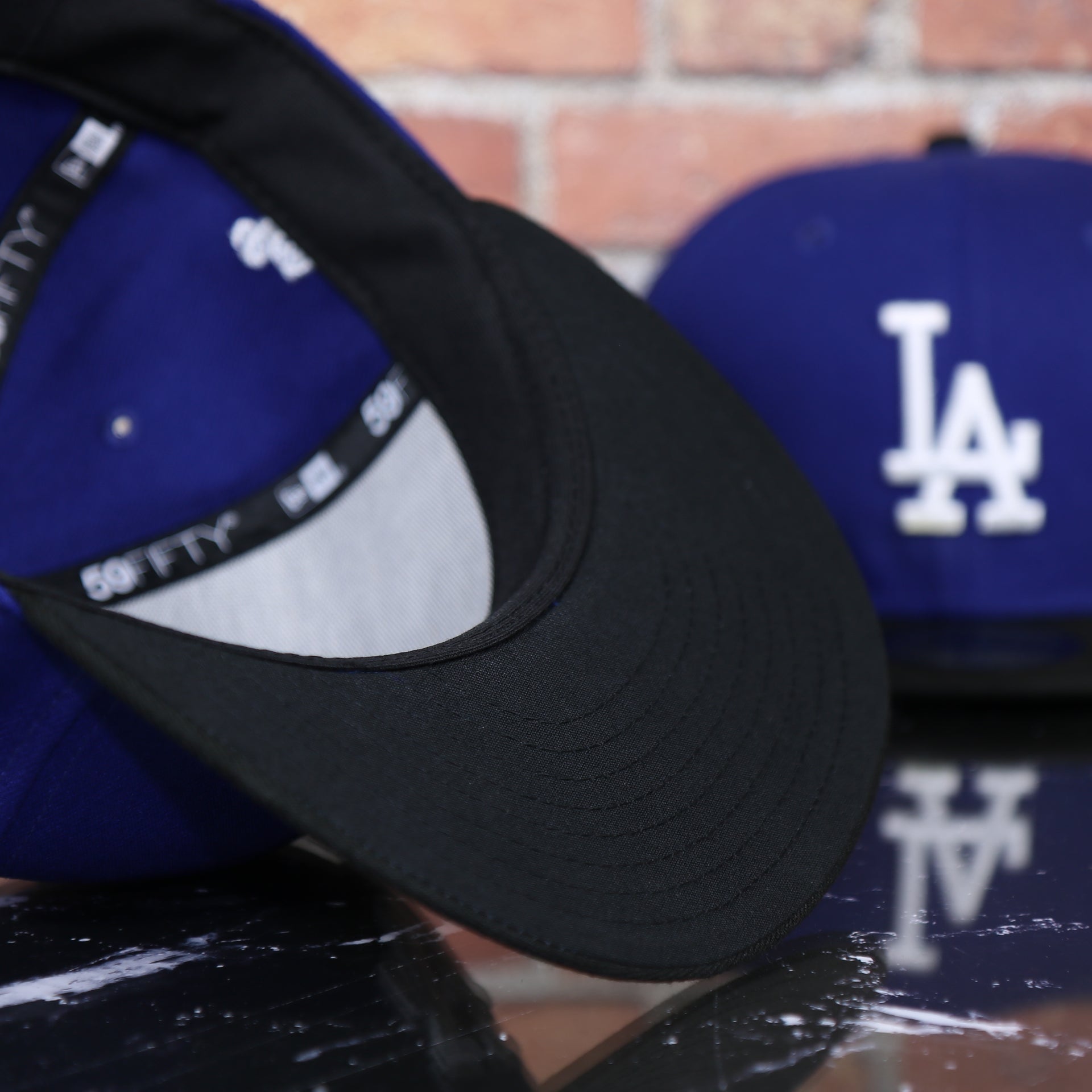 black under visor on the Los Angeles Dodgers 2022 City Connect Side Patch 59Fifty Fitted Cap | New Era Royal/Black