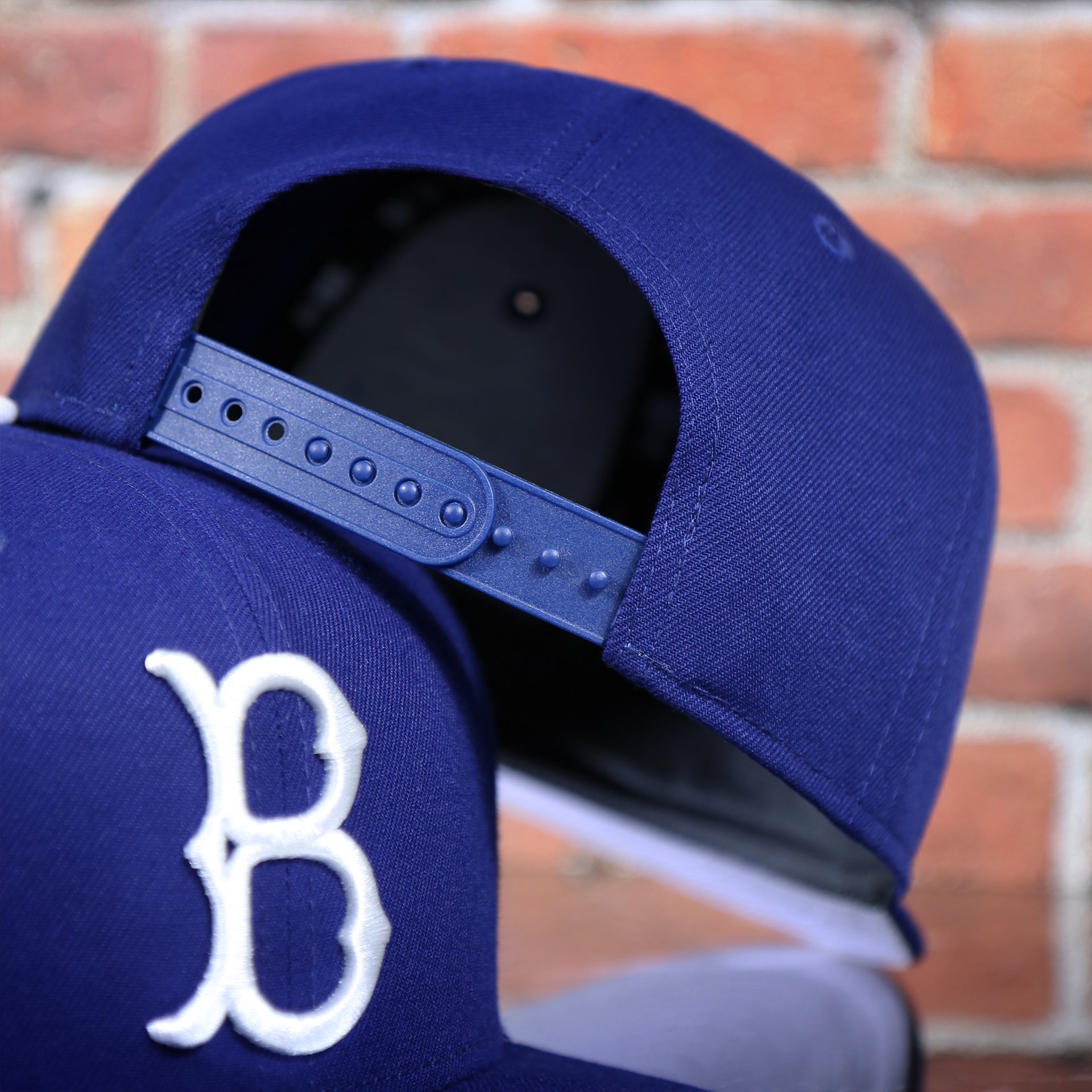 backside of the Brooklyn Dodgers Cooperstown Royal Blue 9Fifty Snapback Cap | OSFM