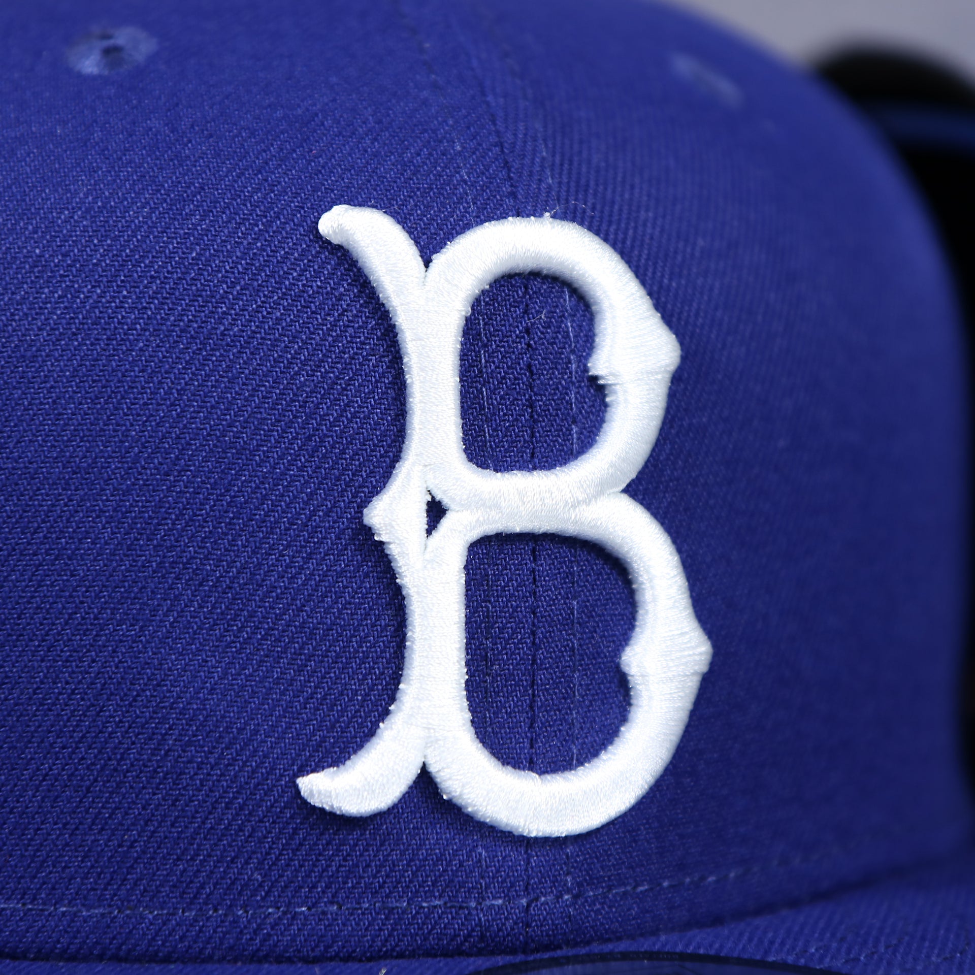 dodger logo on the front of the Brooklyn Dodgers Cooperstown Royal Blue 9Fifty Snapback Cap | OSFM