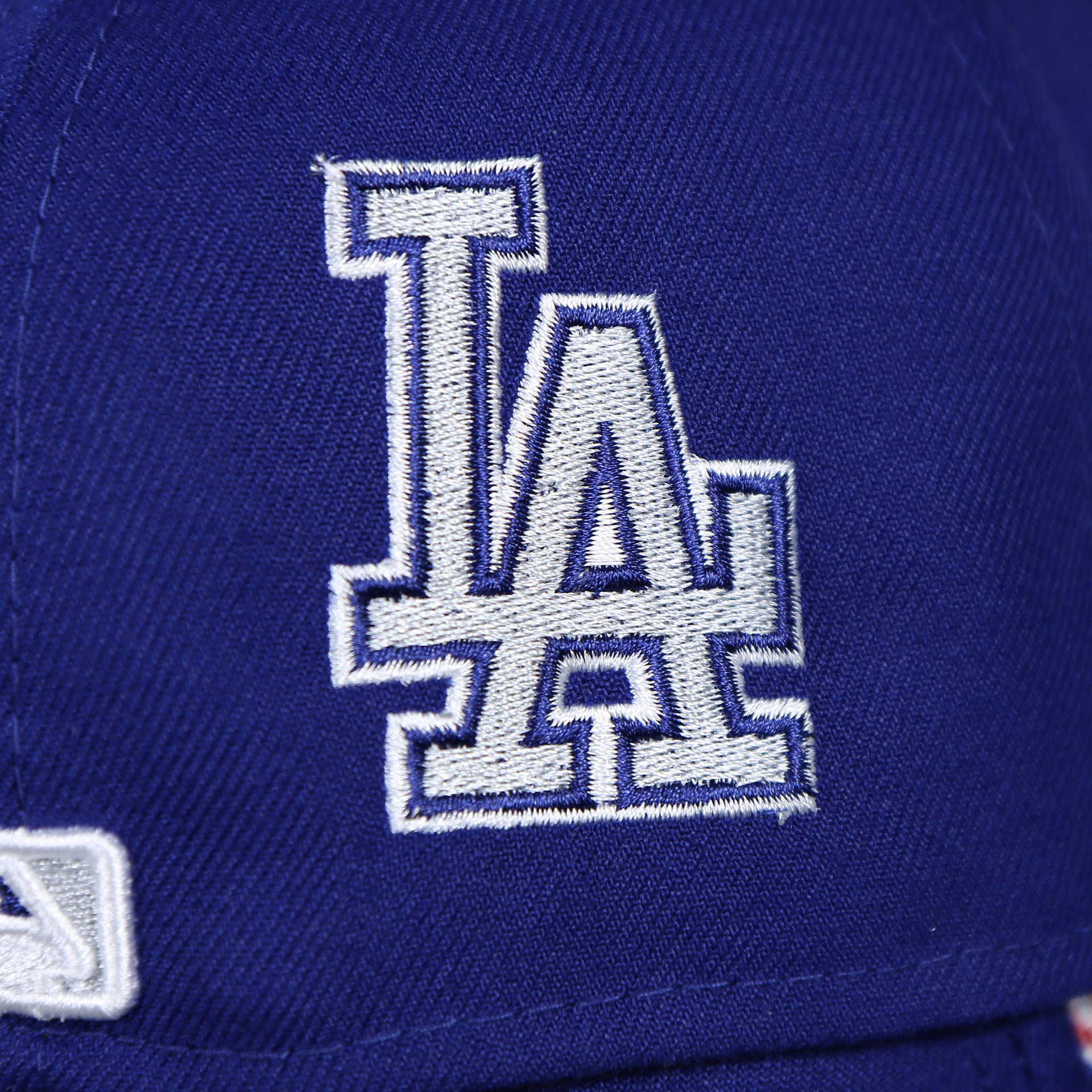 dodgers logo on the Los Angeles Dodgers "Patch Pride" All Over Gray Bottom Side Patch 59Fifty Fitted Cap