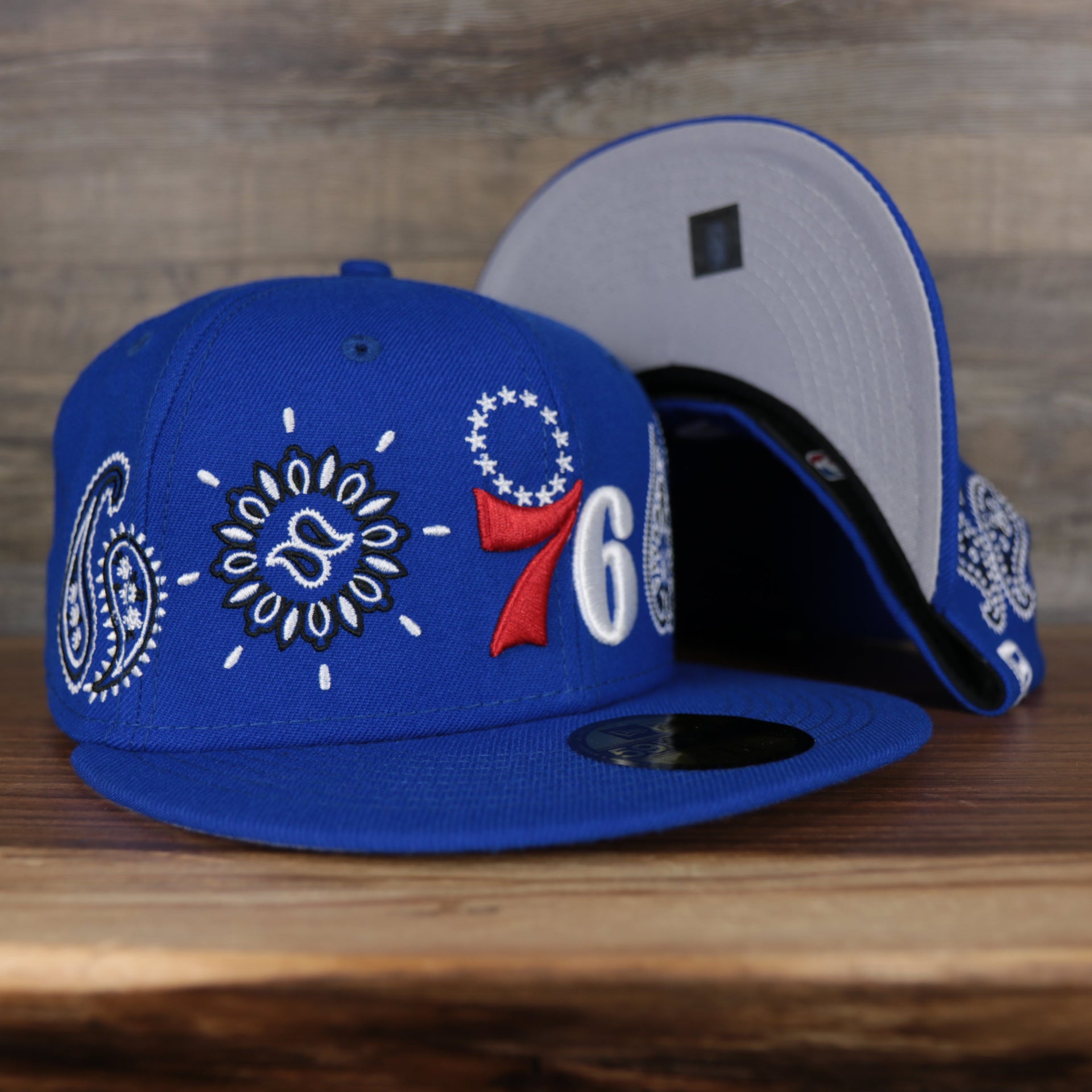 front and bottom of the Philadelphia 76ers All Over Paisley Bandana Pattern Grey Bottom 5950 Fitted Cap | Blue