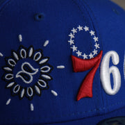 76ers logo on the Philadelphia 76ers All Over Paisley Bandana Pattern Grey Bottom 5950 Fitted Cap | Blue