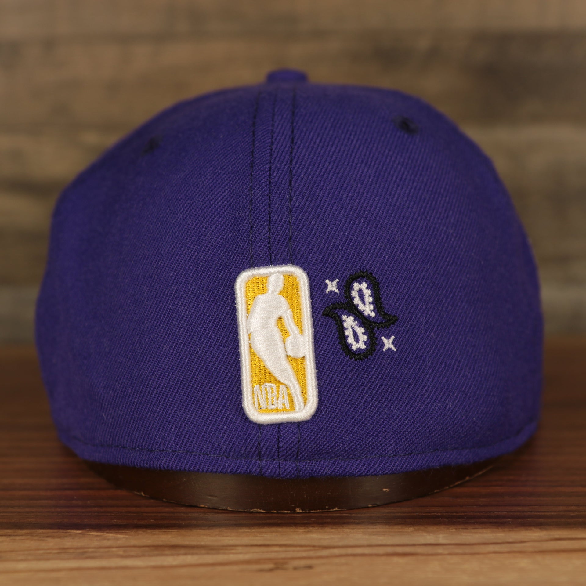 nba logo on the Los Angeles Lakers All Over Paisley Bandana Pattern Grey Bottom 5950 Fitted Cap | Purple