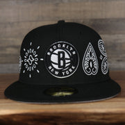front of the Brooklyn Nets All Over Paisley Bandana Pattern Grey Bottom 5950 Fitted Cap | Black