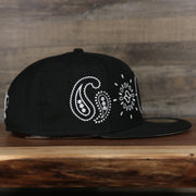 wearers right side of thwe Brooklyn Nets All Over Paisley Bandana Pattern Grey Bottom 5950 Fitted Cap | Black