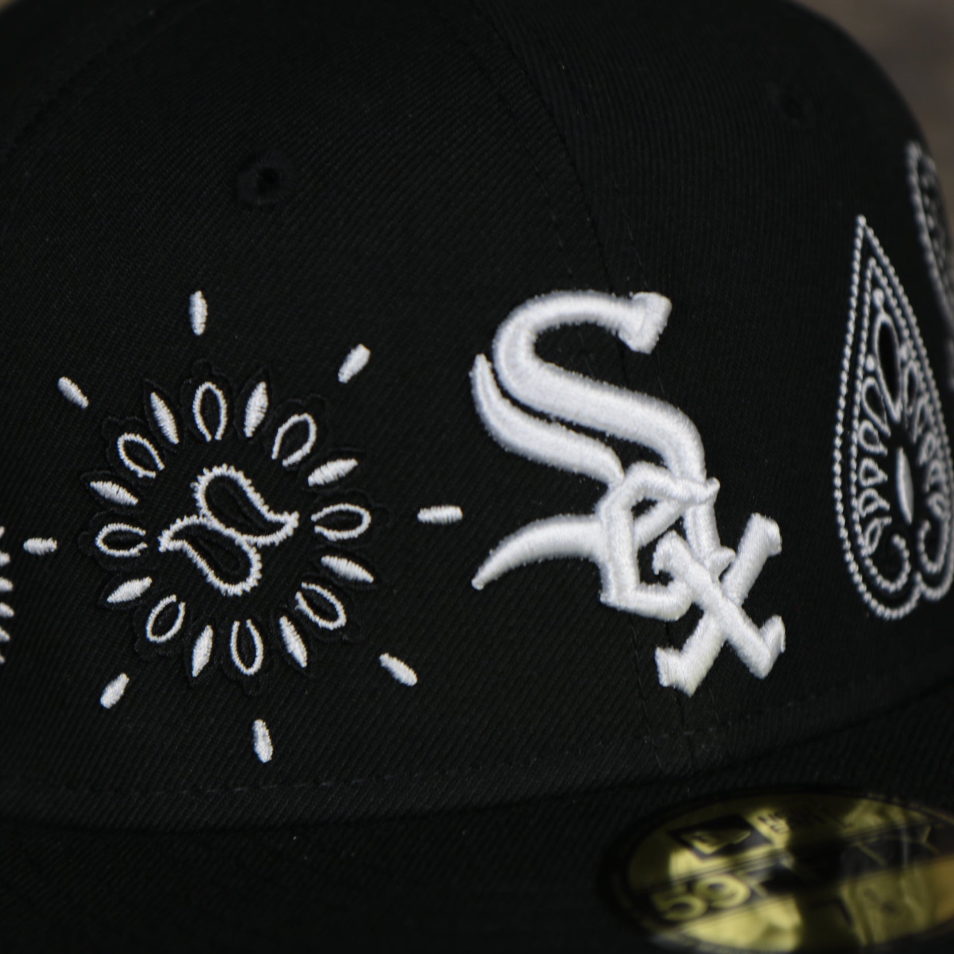 white sox logo on the Chicago White Sox All Over Paisley Bandana Pattern Grey Bottom 5950 Fitted Cap | Black