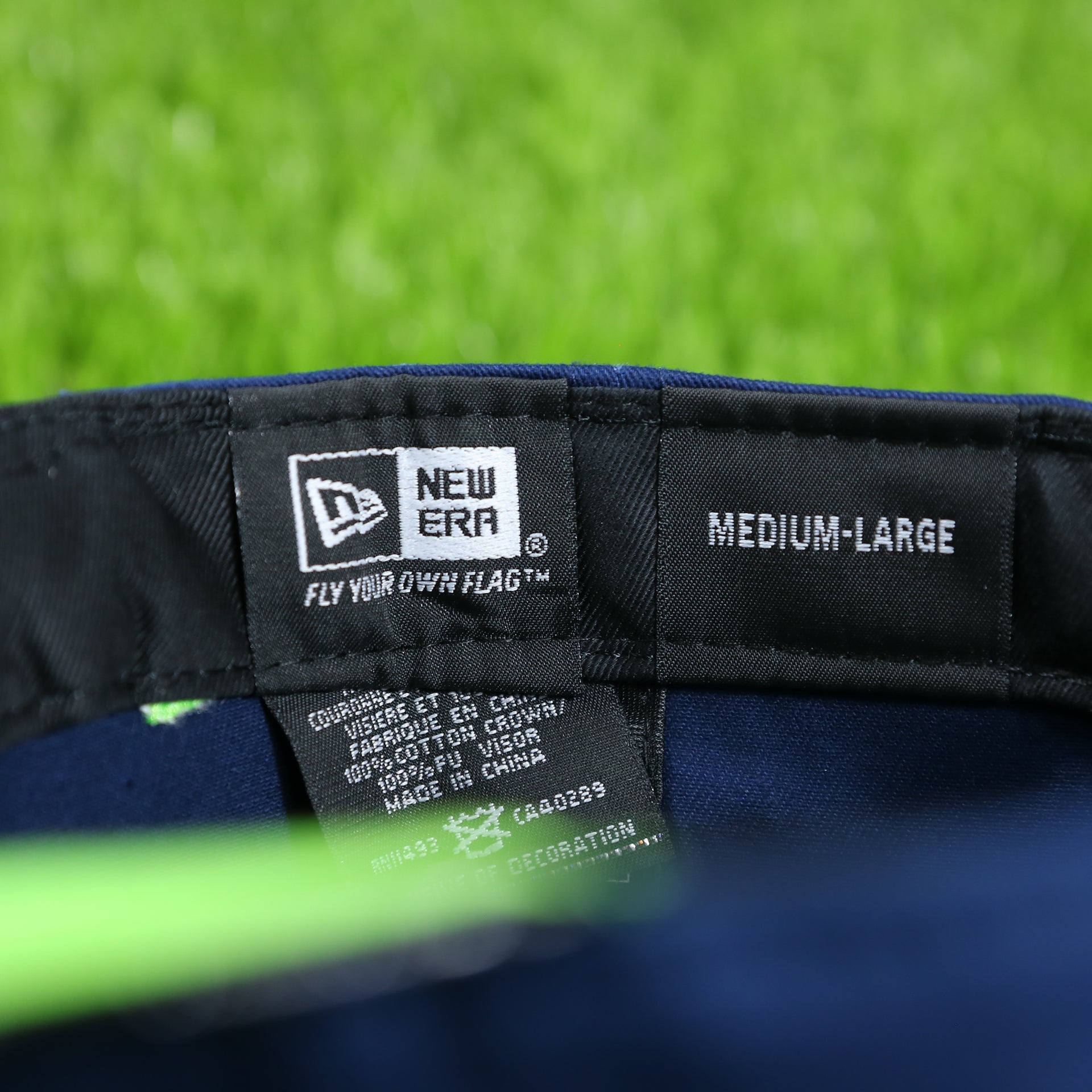 new era tag on the sweatband of the Seattle Seahawks Crocodile Brim Neon Green Bottom 9Fifty Strapback | Navy/Black
