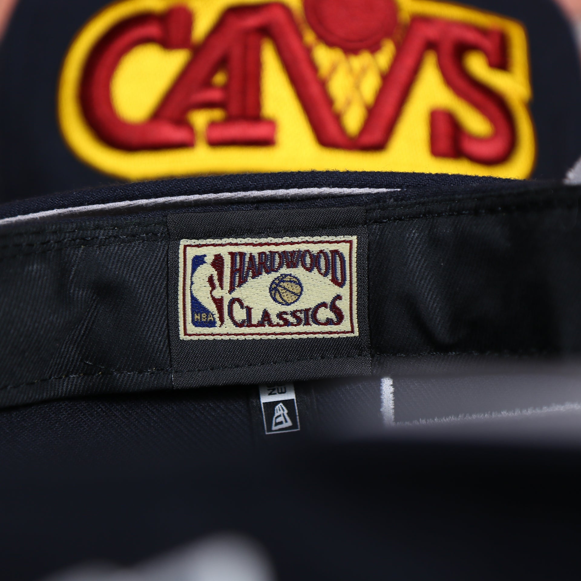 hardwood classic tag on the inside of the Cleveland Cavaliers Vintage City Flag Side Patch Gray Bottom 9Fifty Snapback | Navy