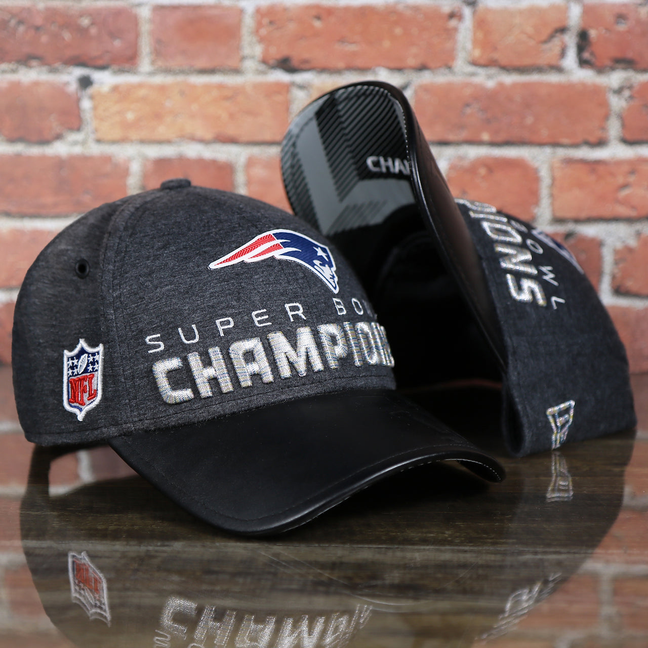front of the New England Patriots Locker Room Super Bowl LI Championship Trophy 9Forty Dad Hat