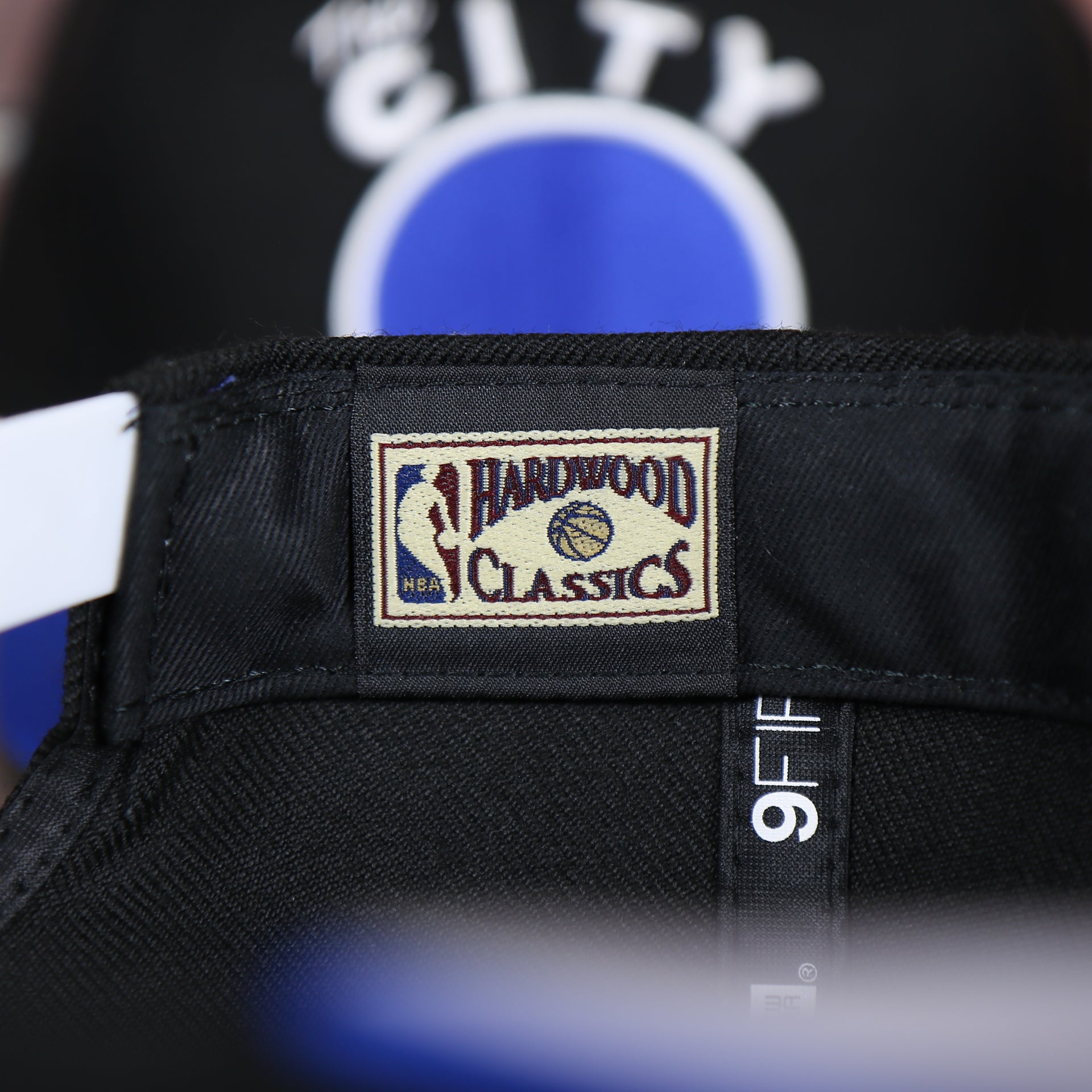 hardwood classic on the tag on the inside of the Golden State Warriors Gray Bottom 9Fifty Snapback Cap | Black
