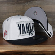 front and bottom of the New York Yankees Retro 9Fifty Grey Bottom Snapback | White