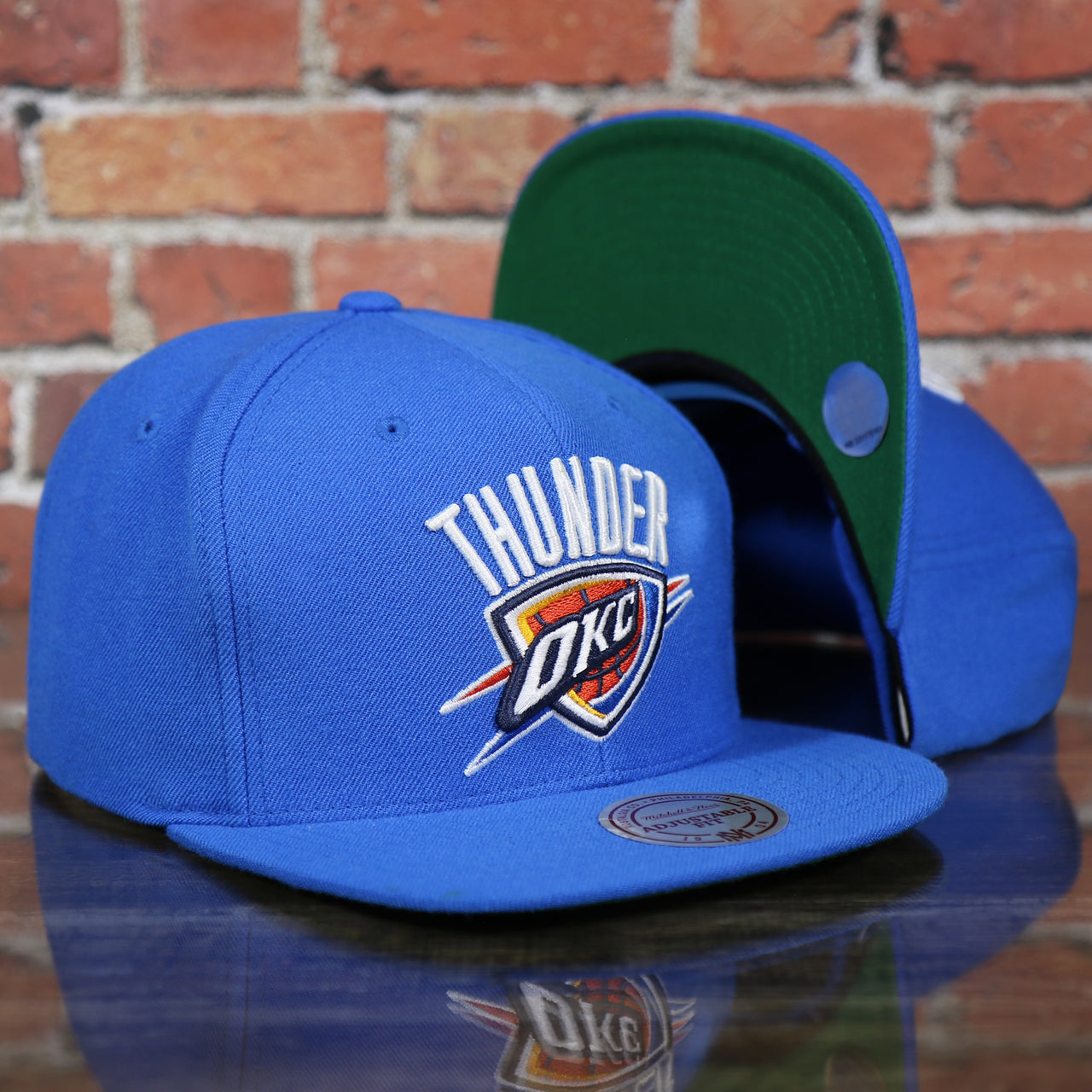 front and bottom of the Oklahoma City Thunder Green Bottom 9Fifty Snapback Cap | Royal Blue