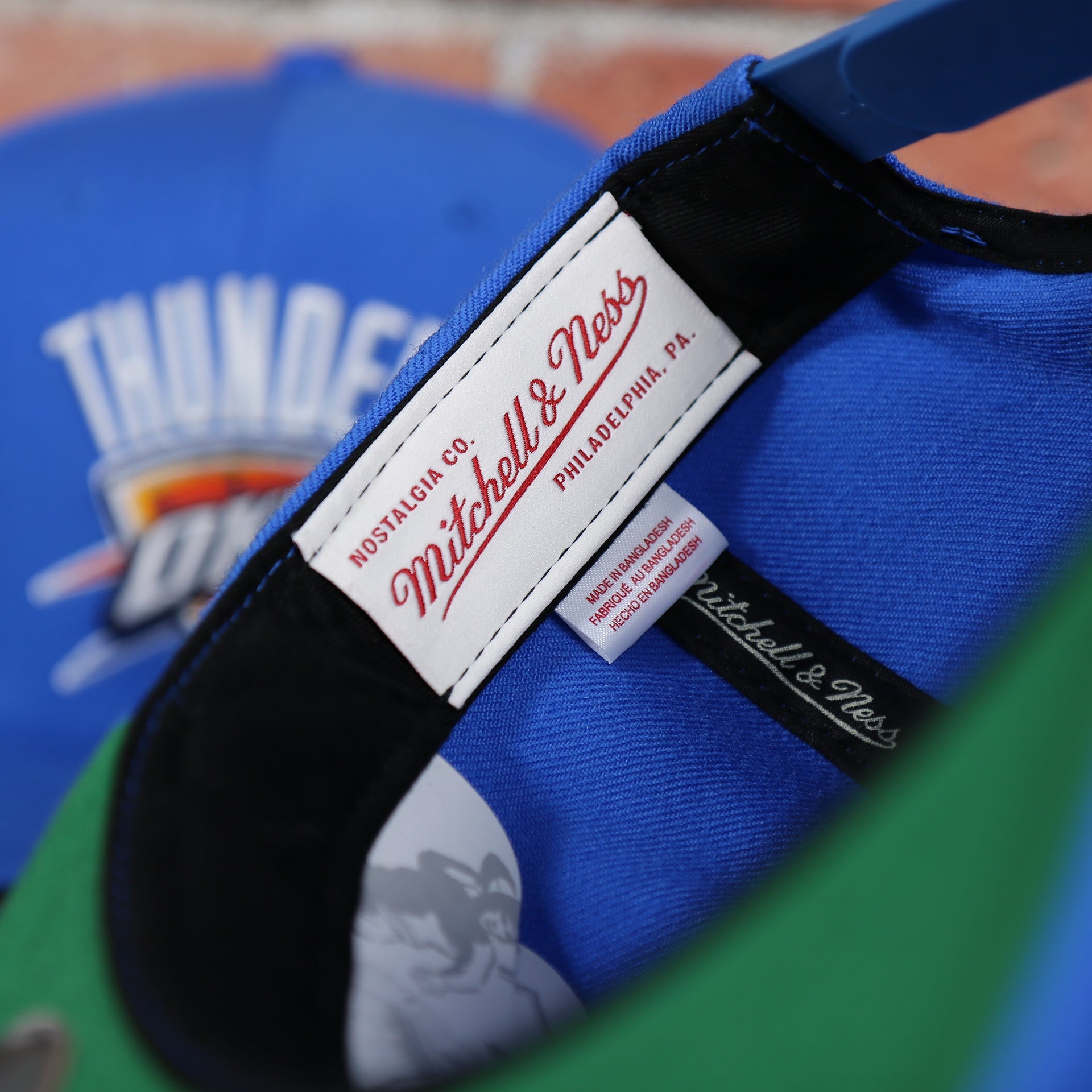 mitchell and ness tag on the inside of the Oklahoma City Thunder Green Bottom 9Fifty Snapback Cap | Royal Blue