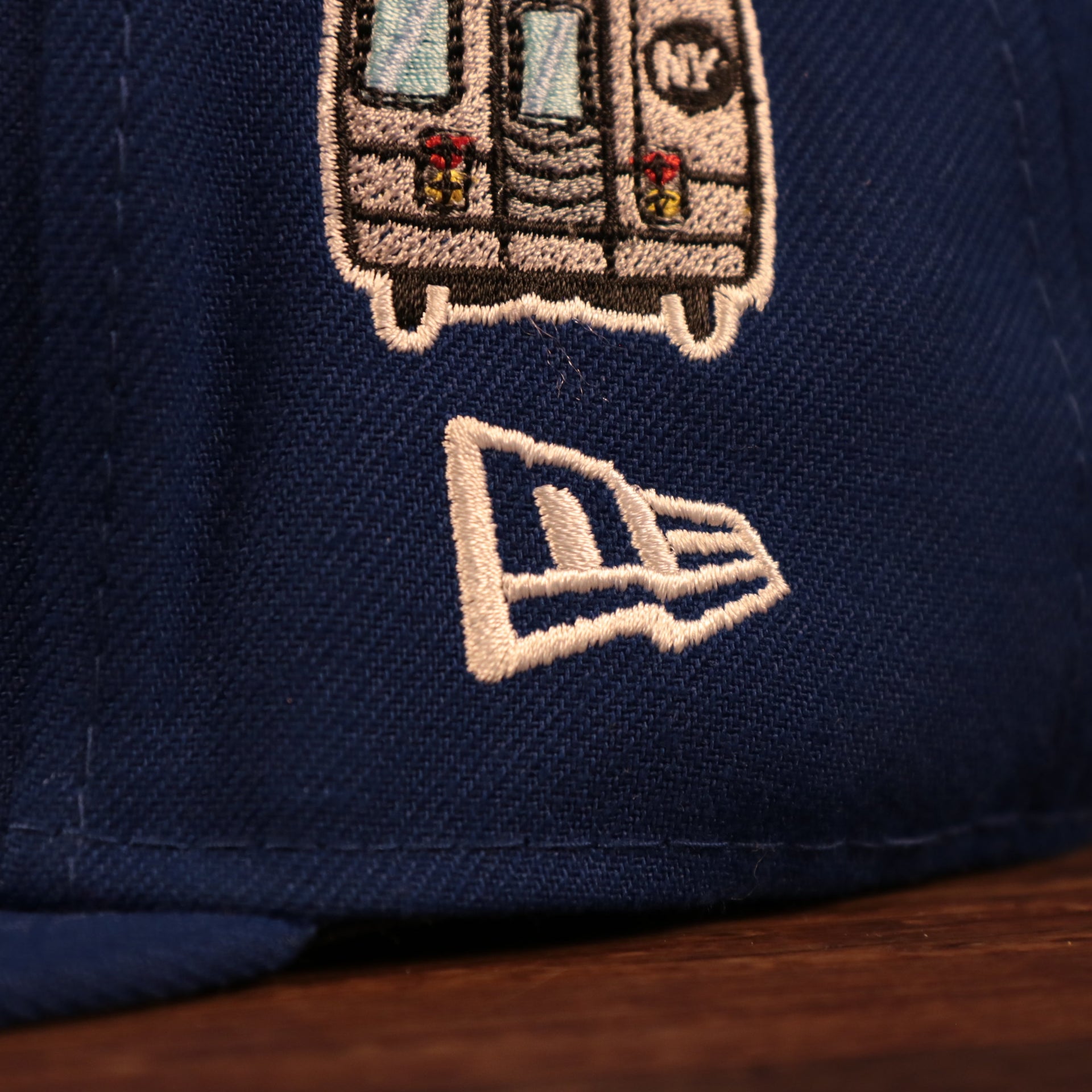 Close up of the New Era logo of the New York Mets City Transit All Over Side Patch Gray Bottom 59Fifty Fitted Cap