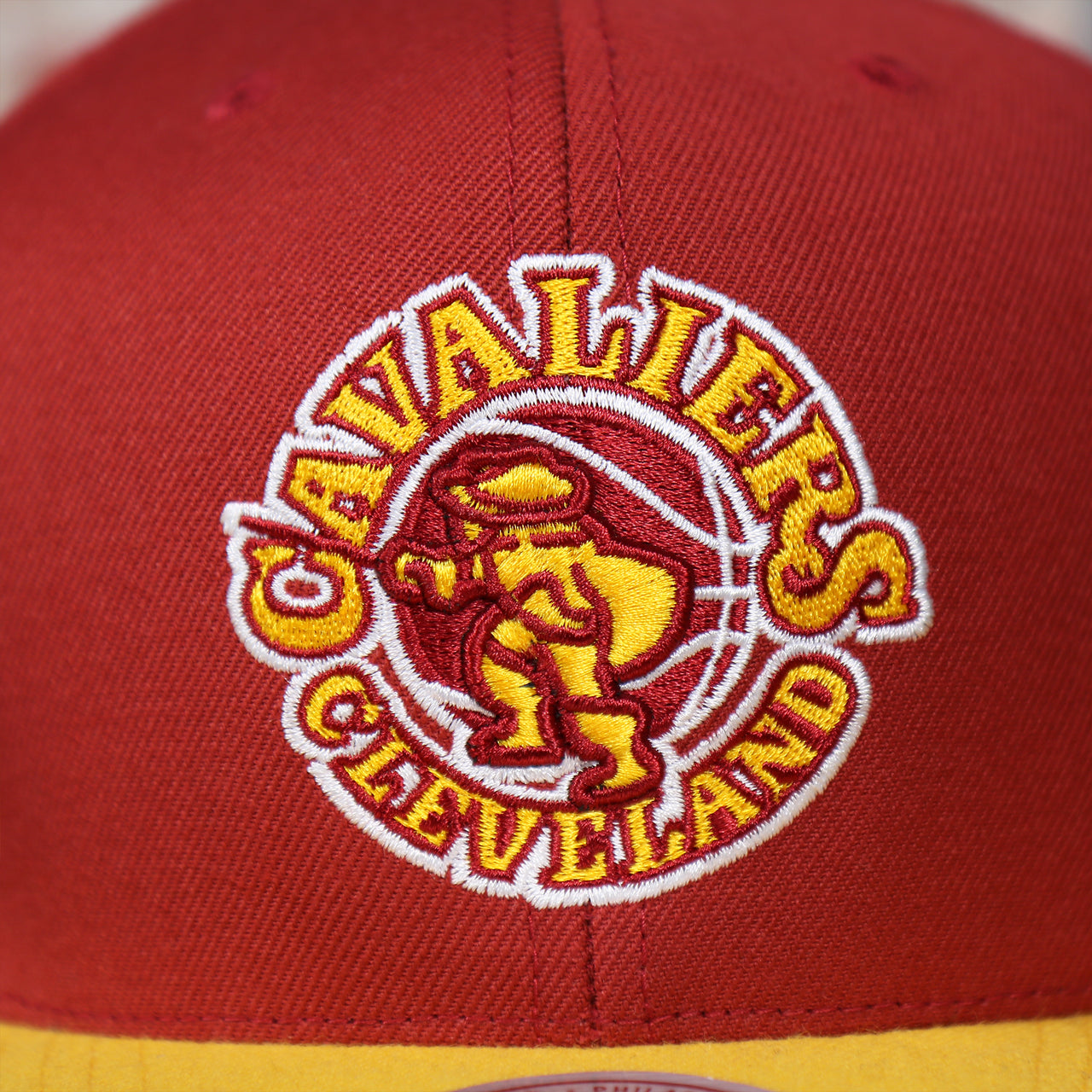 cavalier vintage logo on the front of the Cleveland Cavaliers Vintage Hardwood Classic Gray Bottom 9Fifty Snapback | Red/Yellow