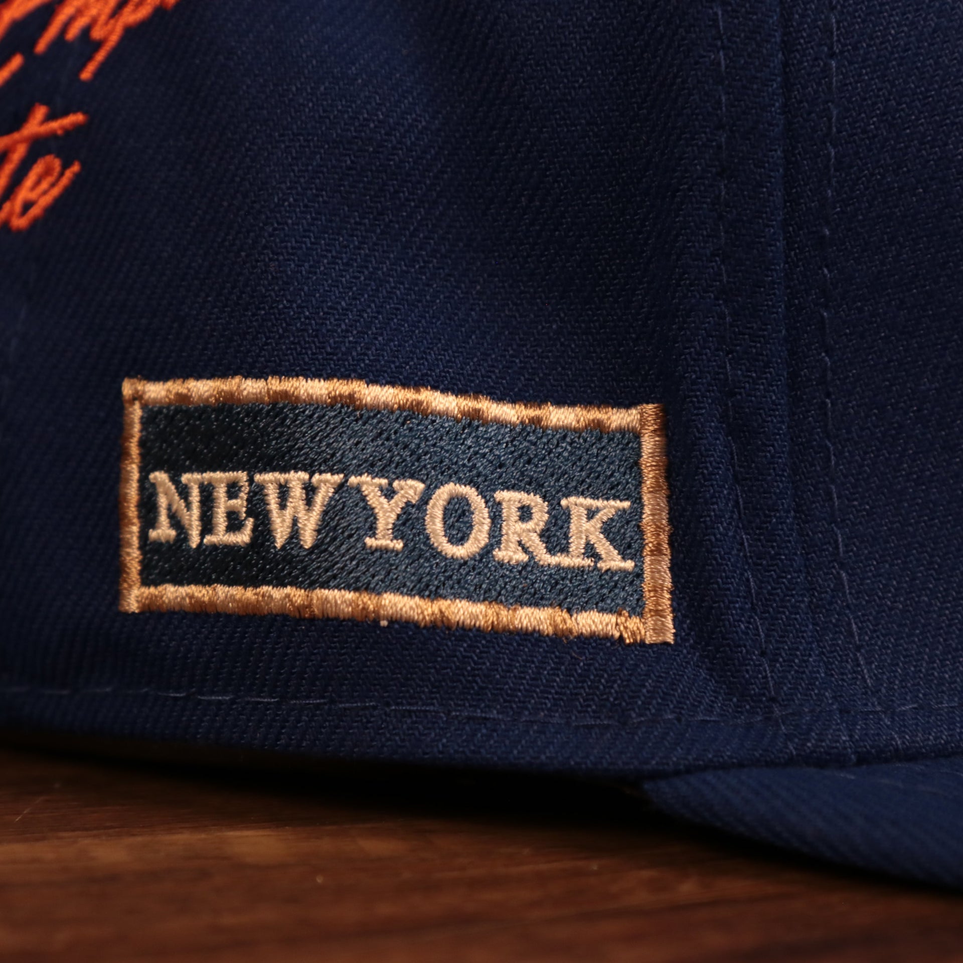 Close up of the New York street sign of the New York Mets City Transit All Over Side Patch Gray Bottom 59Fifty Fitted Cap