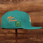 Wearer's right of the Miami Dolphins City Transit All Over Side Patch Gray Bottom 59Fifty Fitted Cap