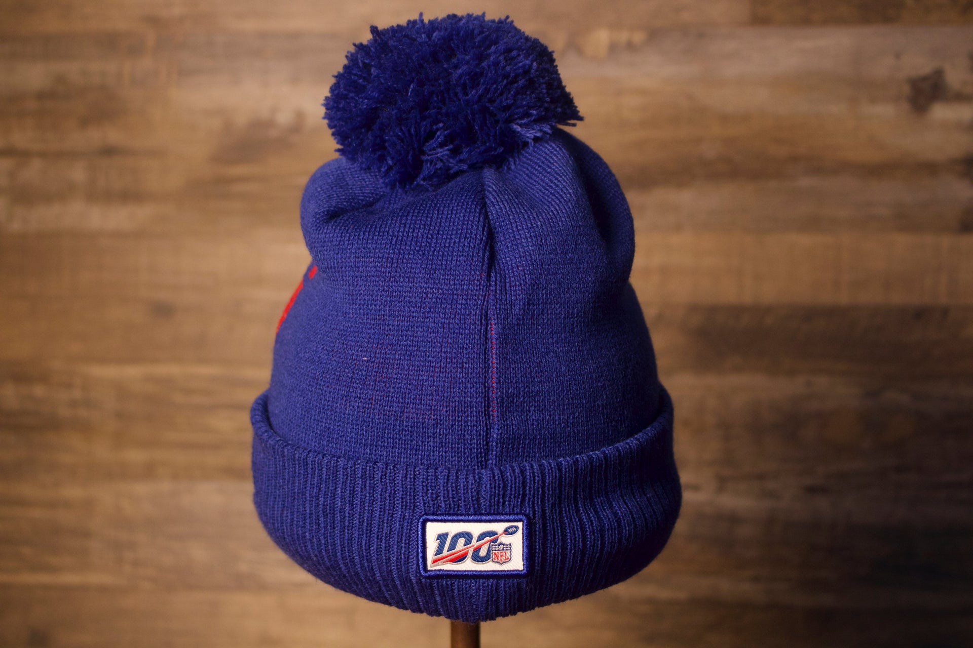 on the back is the nfl 100 patch Giants Beanie | New York Giants 2019 On-Field Beanie | Giants Blue Winter Hat