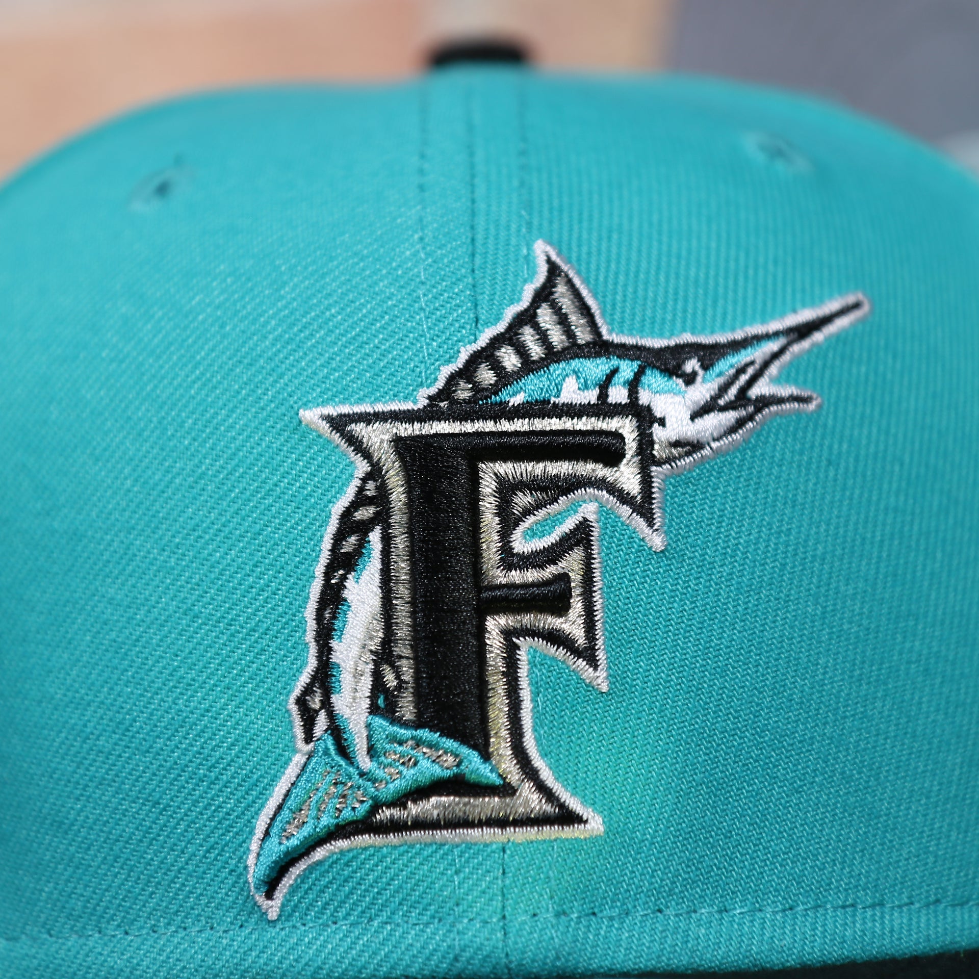 marlins logo on the front of the Florida Marlins Cooperstown 1997 World Series Side Patch Grey Bottom 59Fifty Fitted Cap | Teal