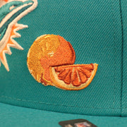 Close up of the orange patch on the Miami Dolphins City Transit All Over Side Patch Gray Bottom 59Fifty Fitted Cap