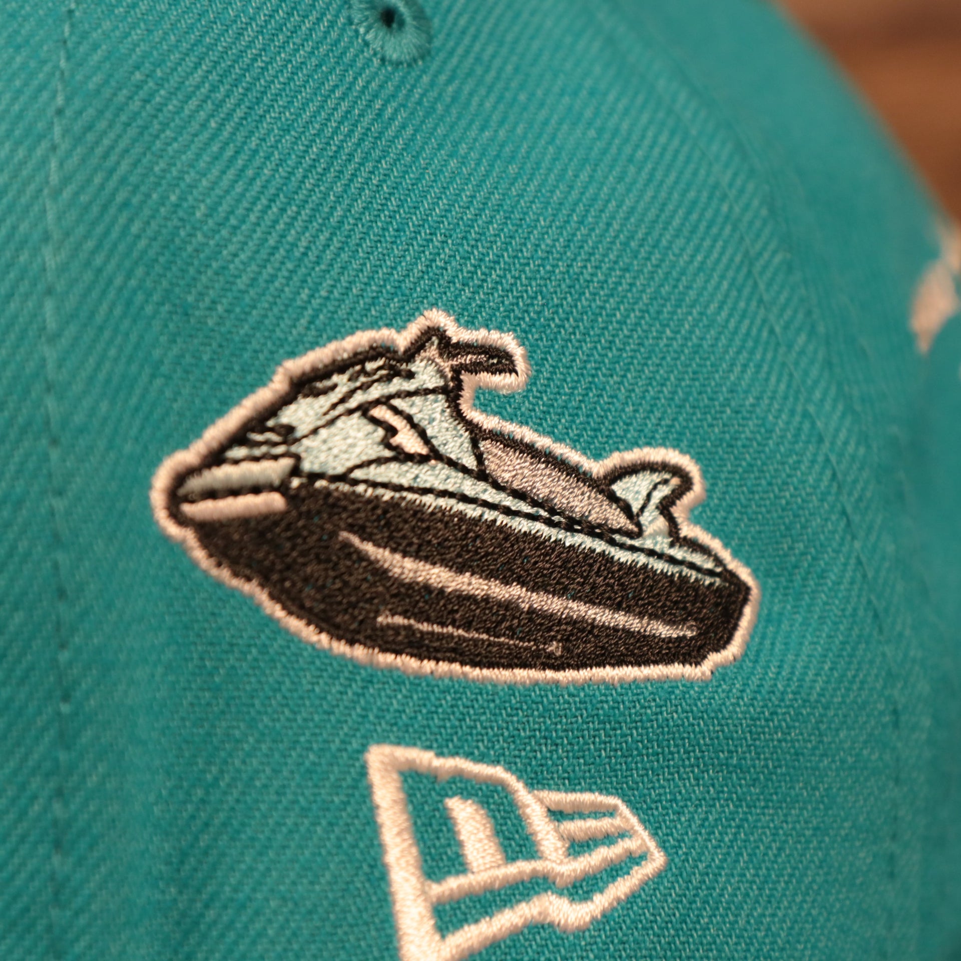 Close up of the jet ski side patch on the Miami Dolphins City Transit All Over Side Patch Gray Bottom 59Fifty Fitted Cap