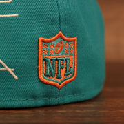 Close up of the NFL shield on the back of the Miami Dolphins City Transit All Over Side Patch Gray Bottom 59Fifty Fitted Cap