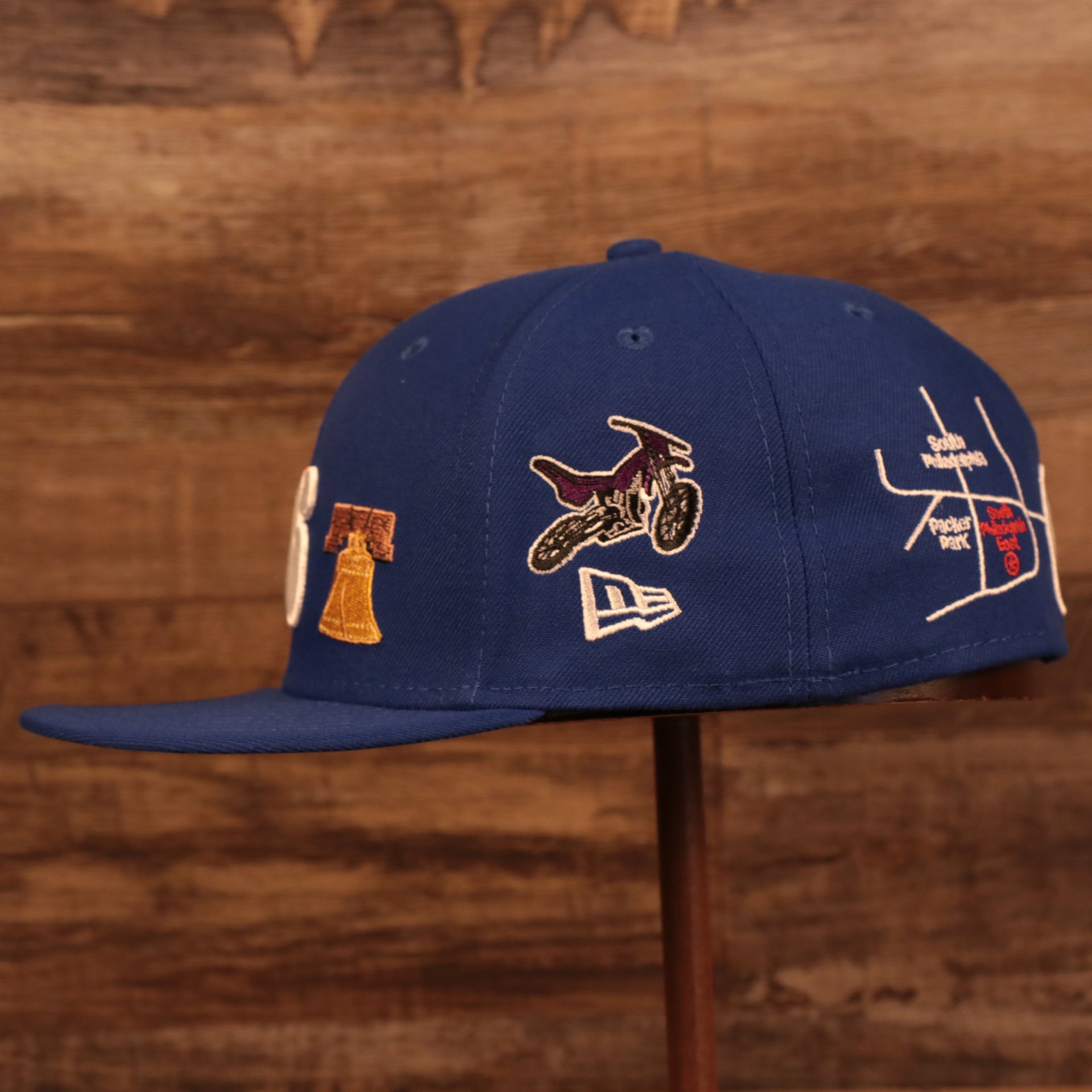 Wearer's left of the Philadelphia 76ers City Transit All Over Side Patch Gray Bottom 59Fifty Fitted Cap