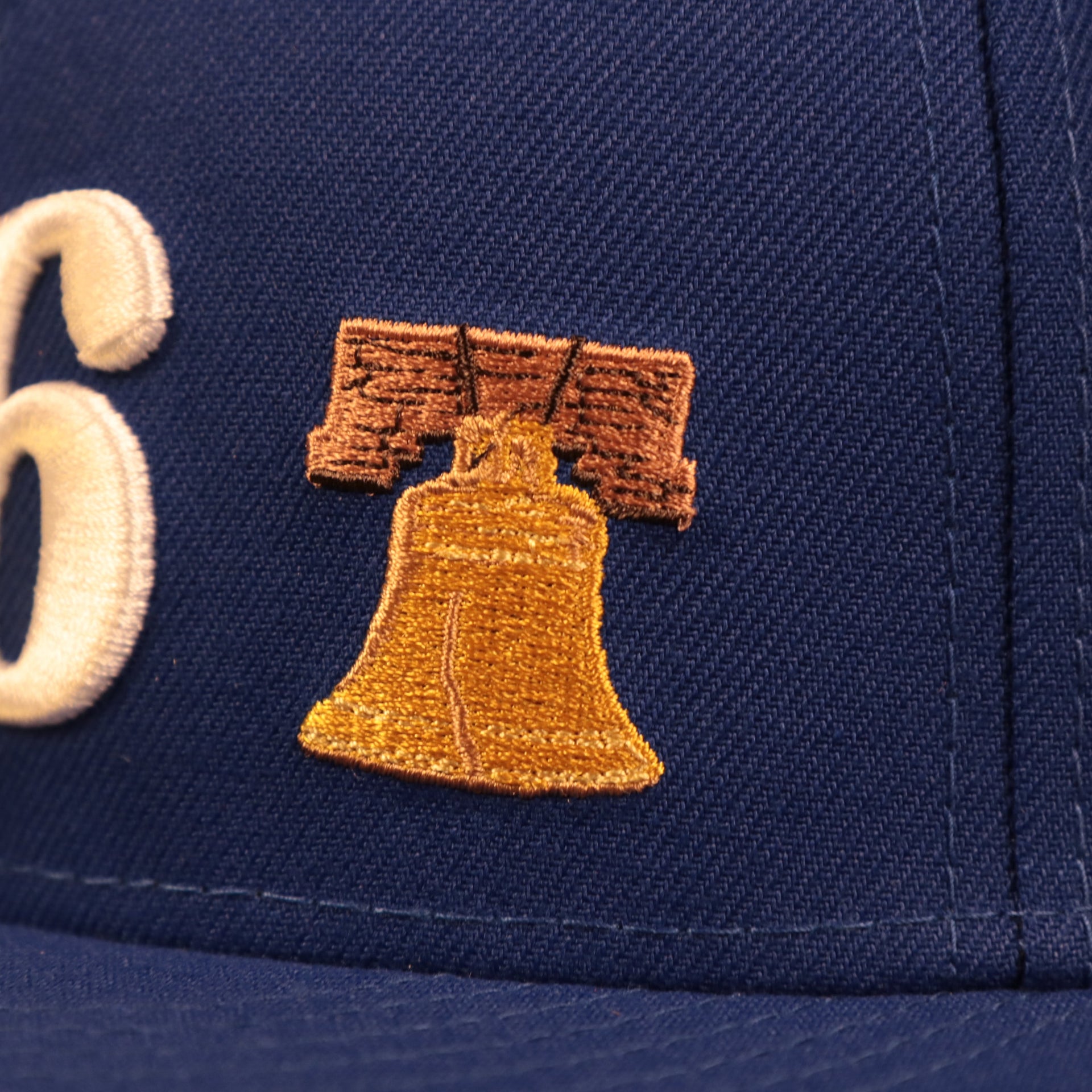 Liberty Bell patch of the Philadelphia 76ers City Transit All Over Side Patch Gray Bottom 59Fifty Fitted Cap